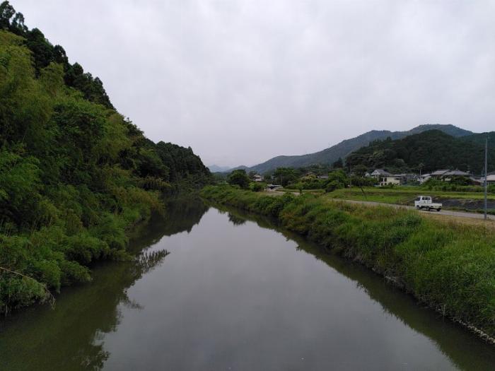The Kusaka river runs by our neighborhood and this is a photo from a bridge over it.  The water is still and there are trees and greenery on both sides.