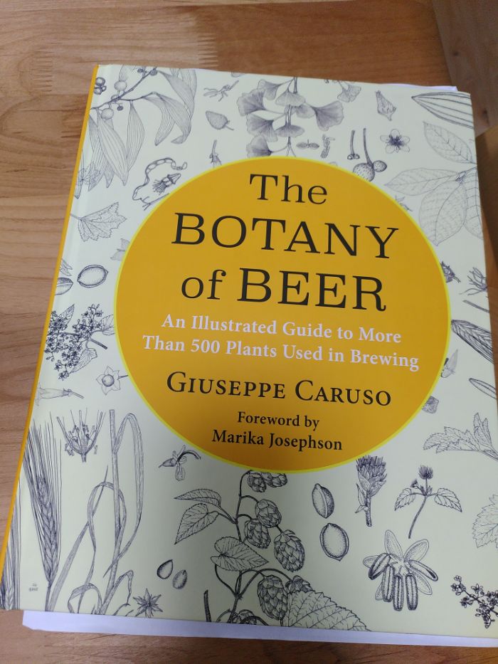The front cover of a book called The Botany of Beer featuring several sketches of plants.