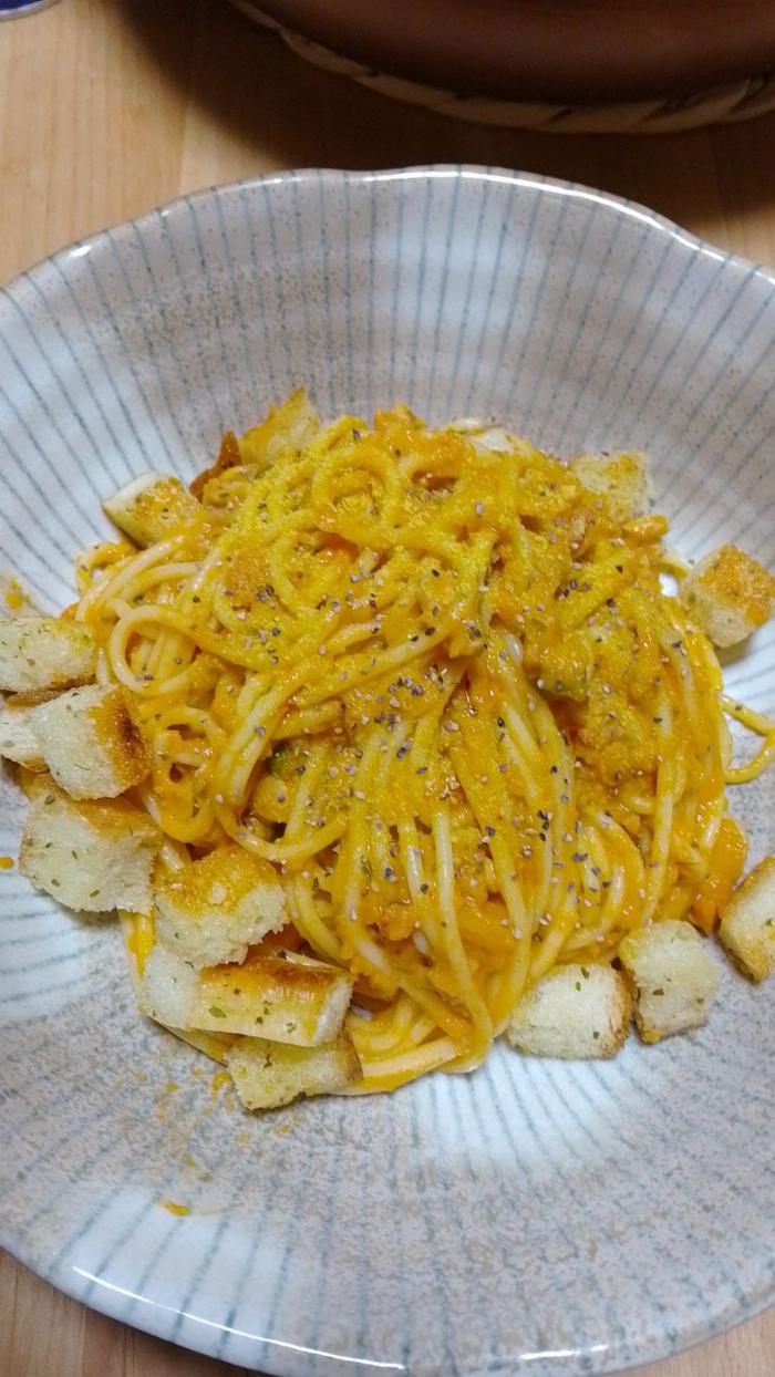 A very saucy spaghetti dish in a bowl.